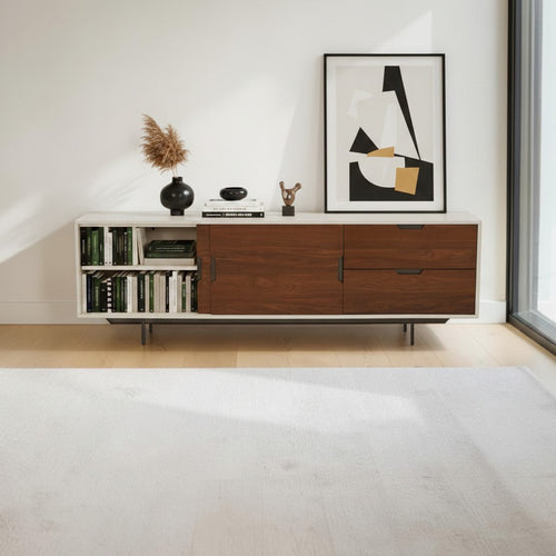 Homecrest Abbott solid wood media stand with white frame, walnut drawers, open shelving, and black metal legs.