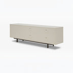 Homecrest Abbott solid wood media stand in a light cream finish with a low-profile design and dark metal legs.