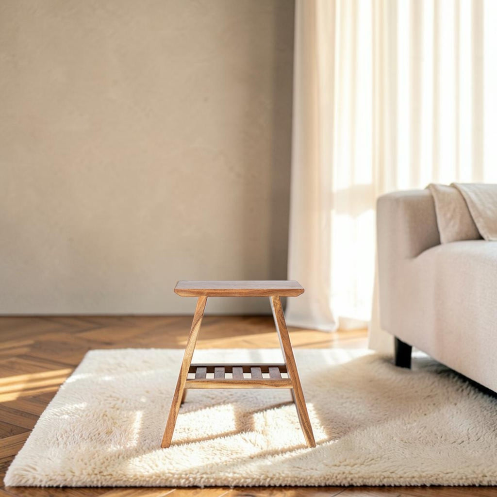 Homecrest A-shaped bedside table in natural acacia wood with a minimalist coastal design on a white rug
