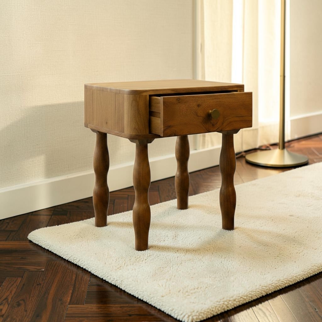 Homecrest Ravenna bedside table in natural acacia wood with a single drawer and curvy legs on a white rug.