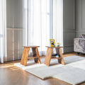 Homecrest Marlin bedside tables in natural acacia wood with angular frames and storage shelves on a white rug.