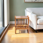 Homecrest handcrafted natural acacia wood Corbel side table with visible wood grain in a living room setting.