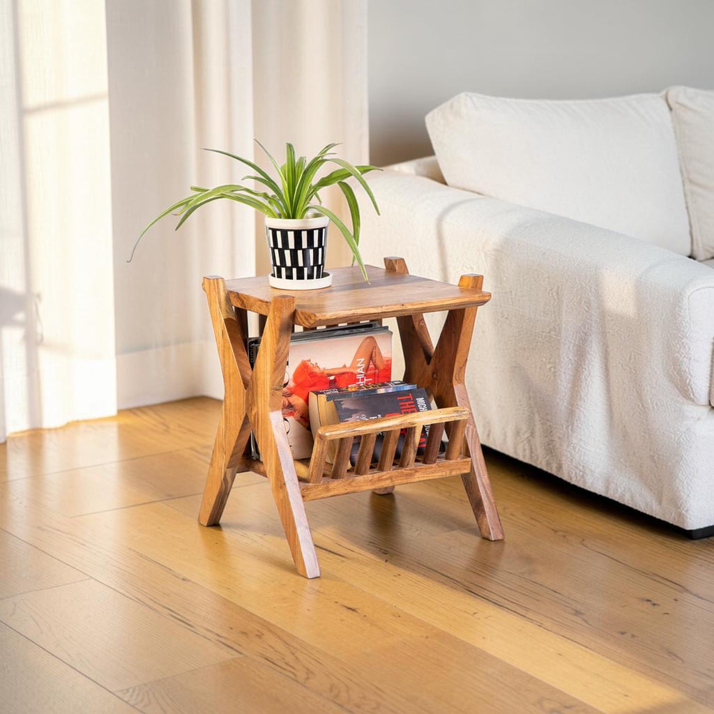 Homecrest handcrafted acacia wood Corbel side table with natural grain finish and a potted plant on top.