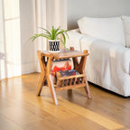 Homecrest handcrafted acacia wood Corbel side table with natural grain finish and a potted plant on top.