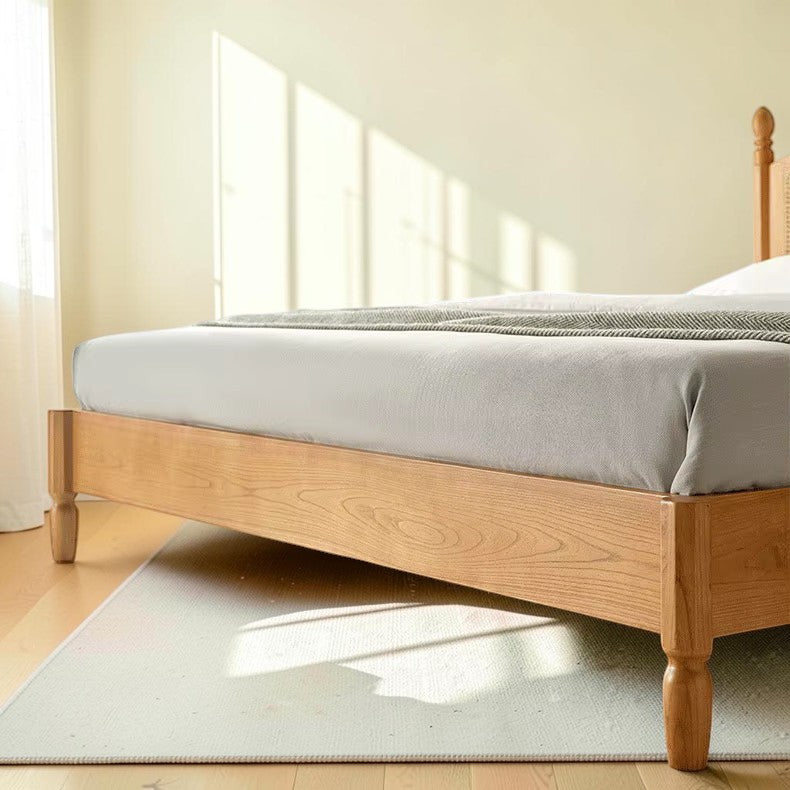 Homecrest mid-century style bed frame in natural acacia wood with rattan cane detailing and a low profile design