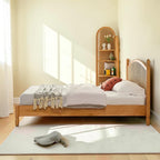 Homecrest mid-century style bed frame in natural acacia wood with a woven rattan cane headboard in a bright bedroom.