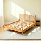 Homecrest mid-century style bed frame in natural acacia wood with a woven rattan cane headboard