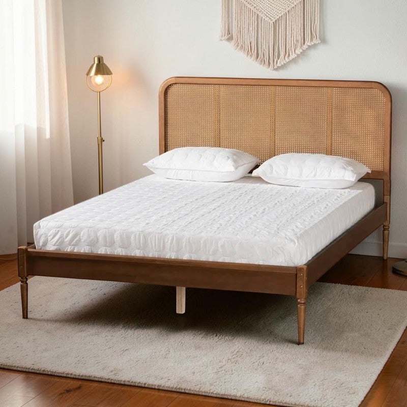 Homecrest classic bed frame in natural acacia wood with a woven rattan cane headboard and tapered legs.
