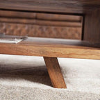 Homecrest Adler coffee table in solid sheesham wood featuring an open storage cubby and a tapered base design.