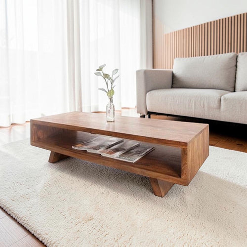 Homecrest Adler low rectangular coffee table in solid sheesham wood with an open storage cubby and tapered base.