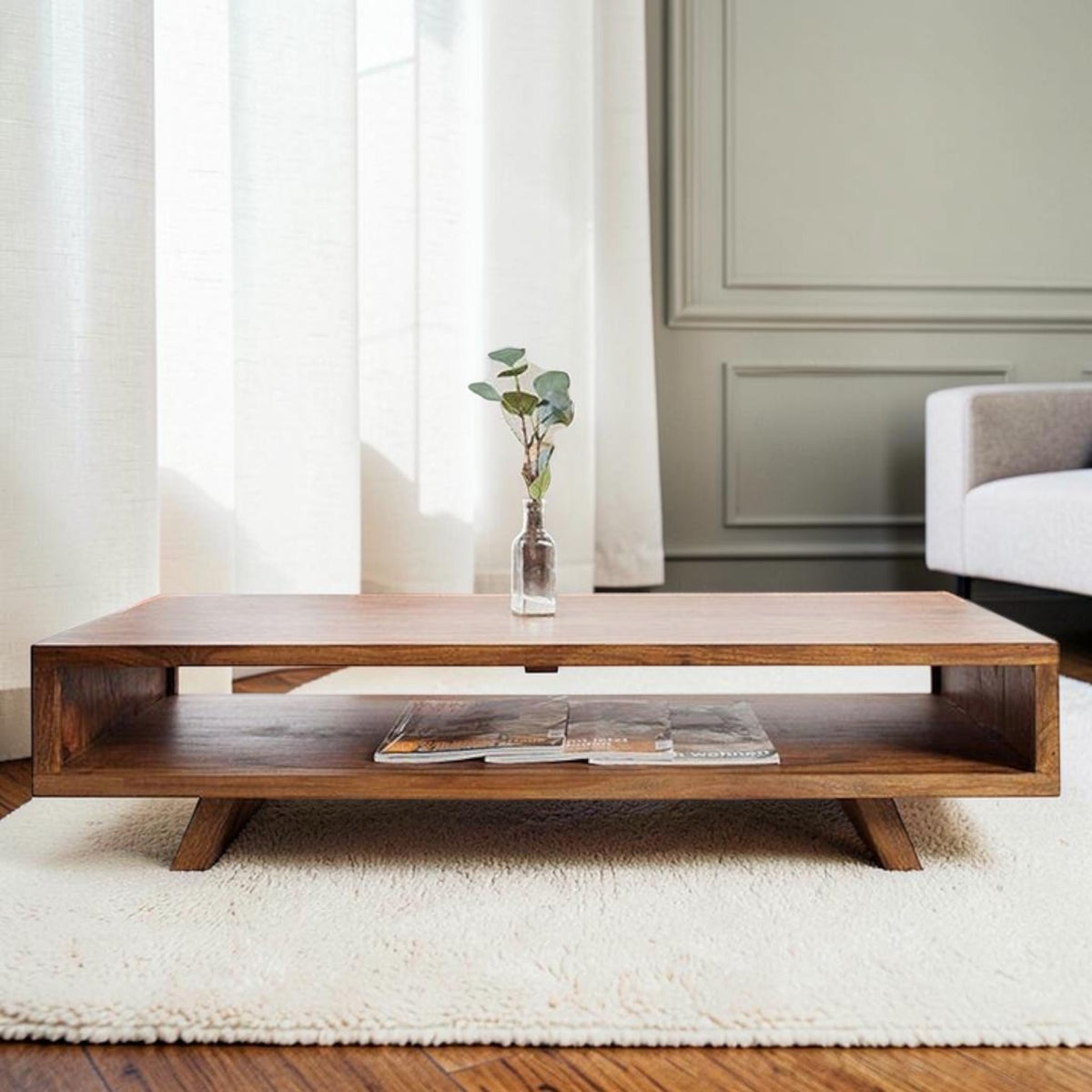 Homecrest Adler low profile rectangular coffee table in solid sheesham wood with an open storage cubby and tapered base