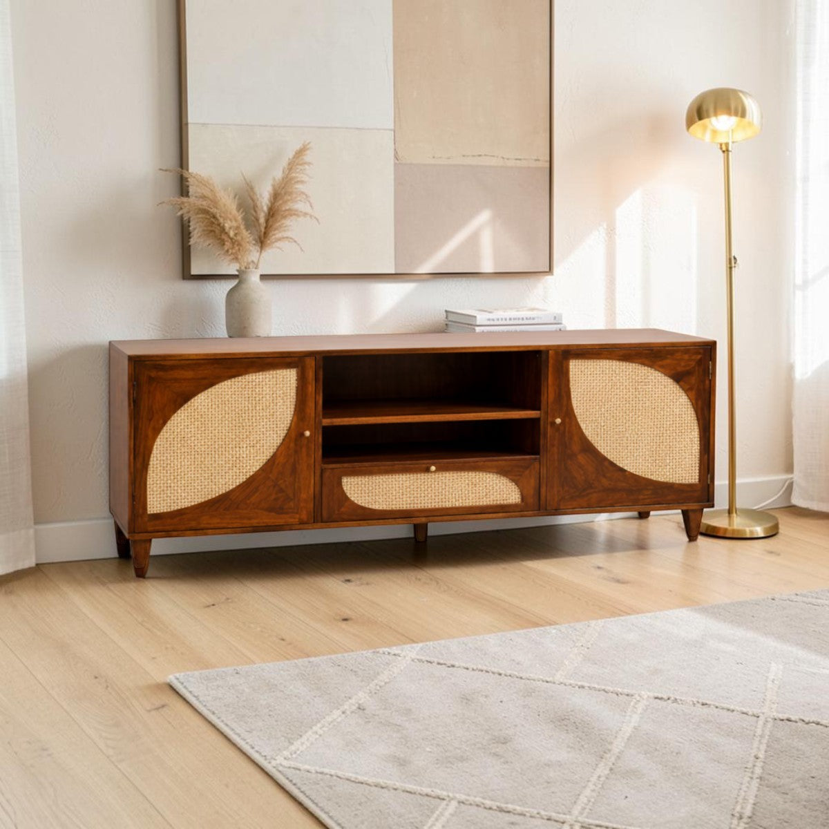 Homecrest Aldon media unit in honey wood with half-moon cane webbing doors, open shelving, and a cane-fronted drawer.