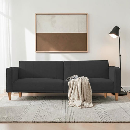 Homecrest Aldous three-seater sofa bed in dark grey polyester fabric with solid wood legs in a modern living room