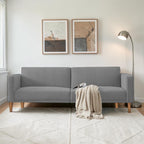Homecrest Aldous light grey three-seater sofa bed with polyester upholstery and solid wood legs in a modern living room