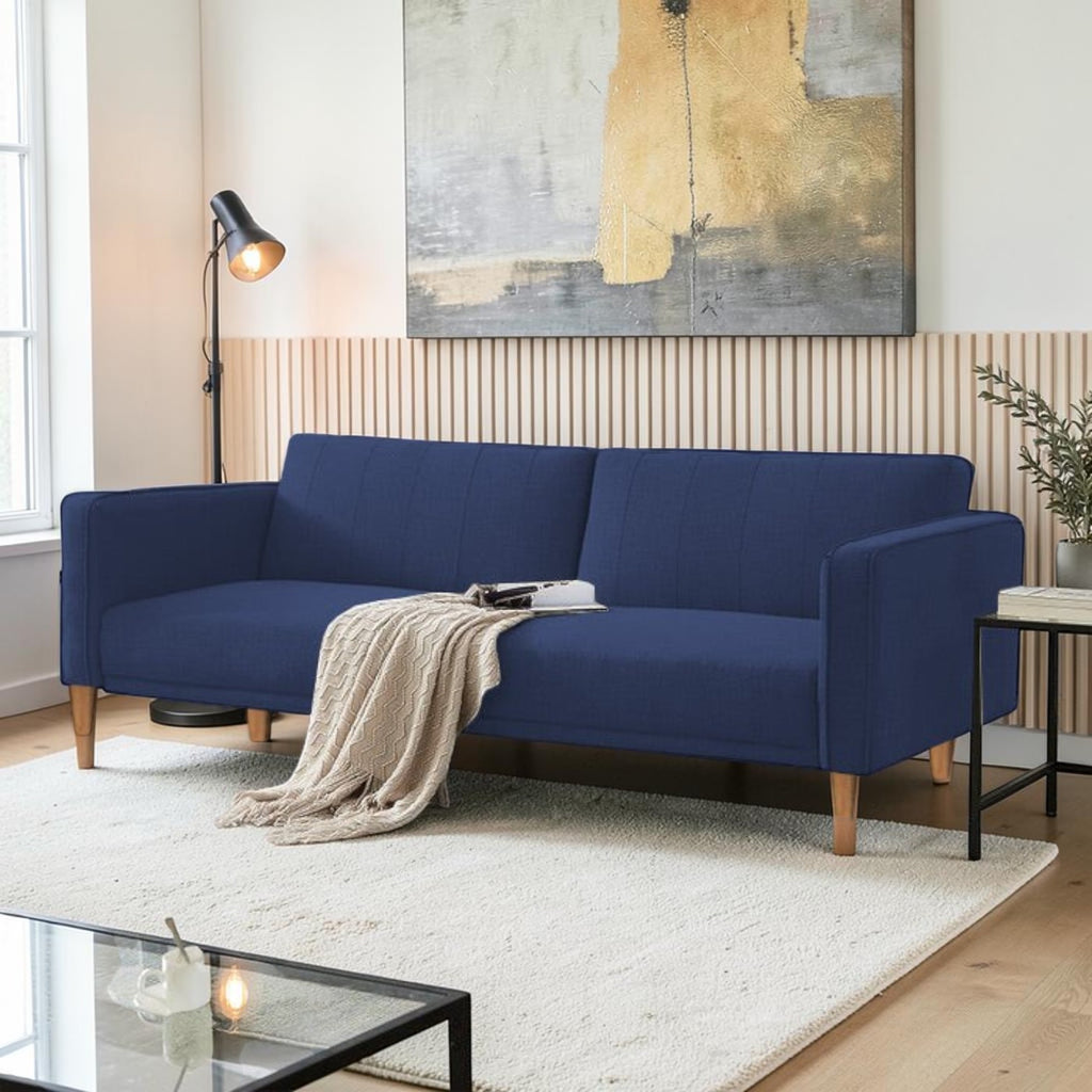 Homecrest Aldous navy blue three-seater sofa bed with polyester upholstery and solid wood legs in a modern living room