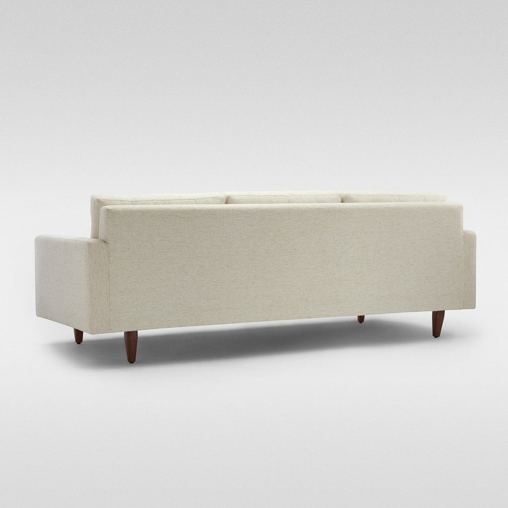Homecrest Aldric contemporary sofa in bone fabric with slim teakwood legs, viewed from the back.