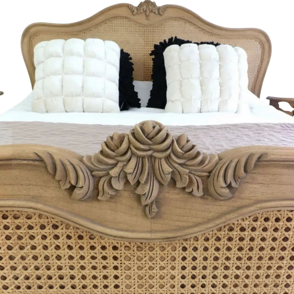 Homecrest Ancaster hand-carved mango wood bed featuring intricate floral carvings and natural rattan paneling