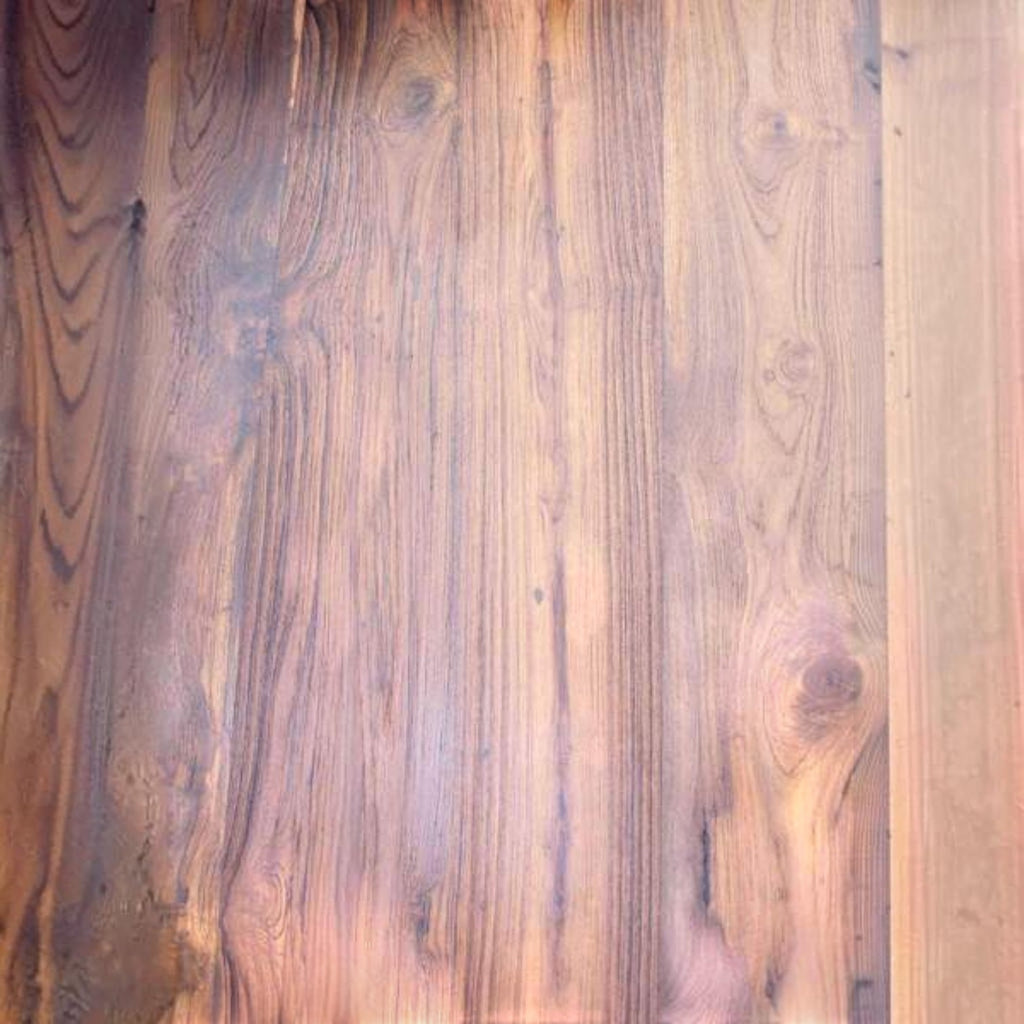 Close-up of Homecrest Anders dining table surface showing the rich grain and texture of seasoned old teak wood
