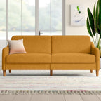 Homecrest Ashcroft mustard yellow polyester three-seat sofa with rounded arms and wooden legs in a bright living room