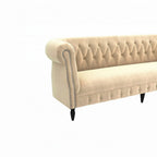 Homecrest Baslow Chesterfield sofa in beige velvet with tufted backrest, rolled arms, and silver nailhead trim.