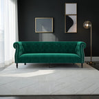 Homecrest Baslow emerald green velvet Chesterfield sofa with tufted back and nailhead trim in a modern living room