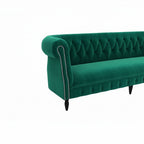 Homecrest Baslow emerald green velvet Chesterfield sofa with tufted back and silver nailhead trim on armrest.
