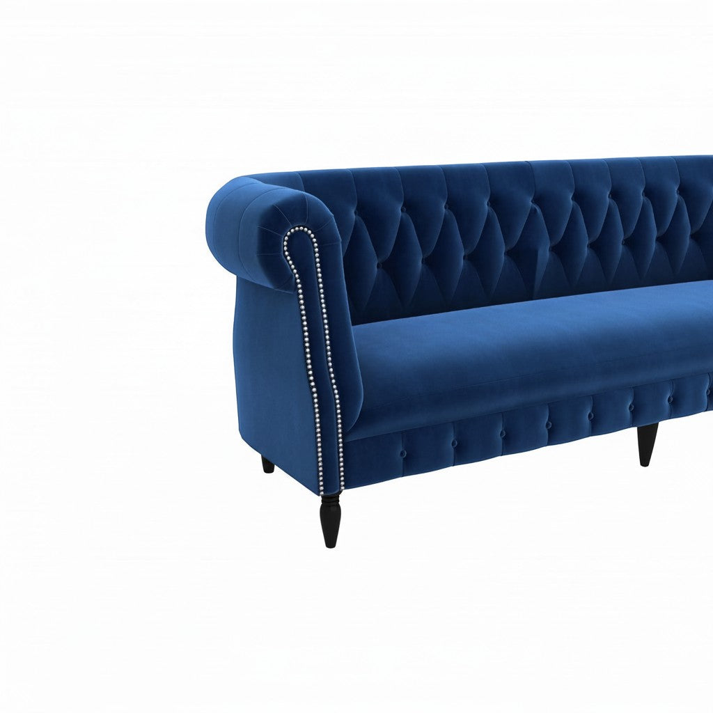 Homecrest Baslow sofa in indigo blue velvet with classic Chesterfield tufted back and silver nailhead trim detail