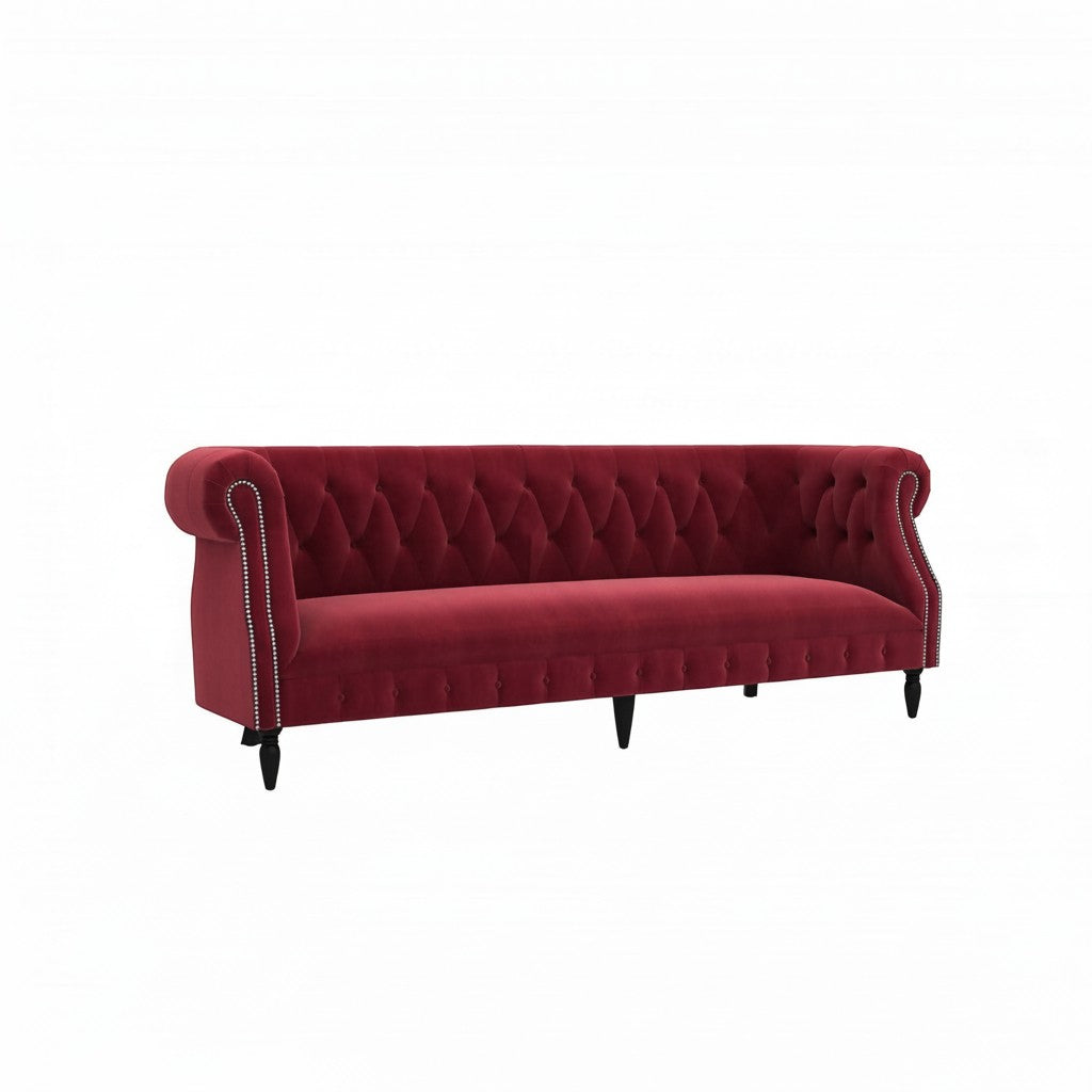 Homecrest Baslow three-seater Chesterfield sofa in pomegranate red velvet with tufted back and nailhead trim