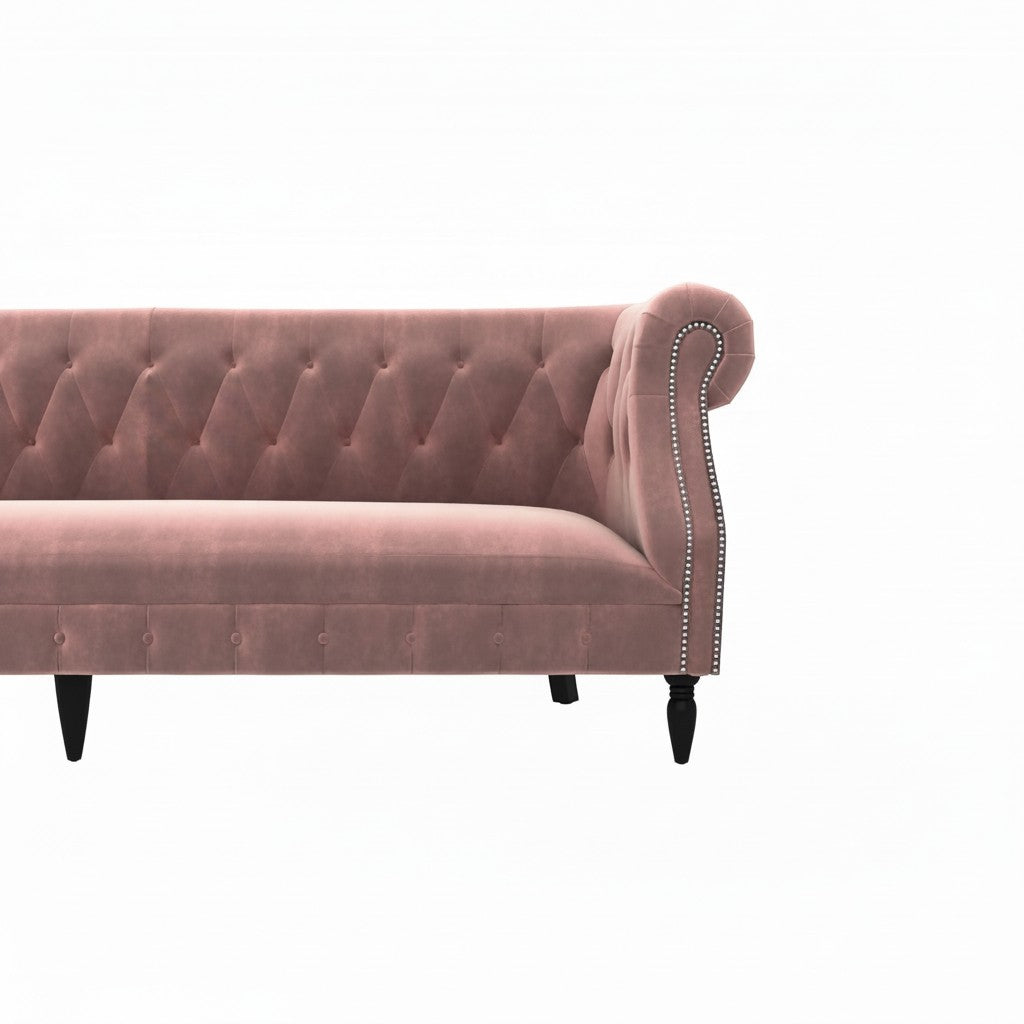 Homecrest Baslow Chesterfield sofa in rose dust velvet with button tufting, rolled arms, and silver nailhead trim.