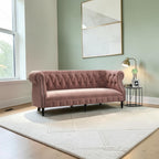 Homecrest Baslow Chesterfield sofa in rose dust velvet with tufted back and nailhead trim in a modern living room