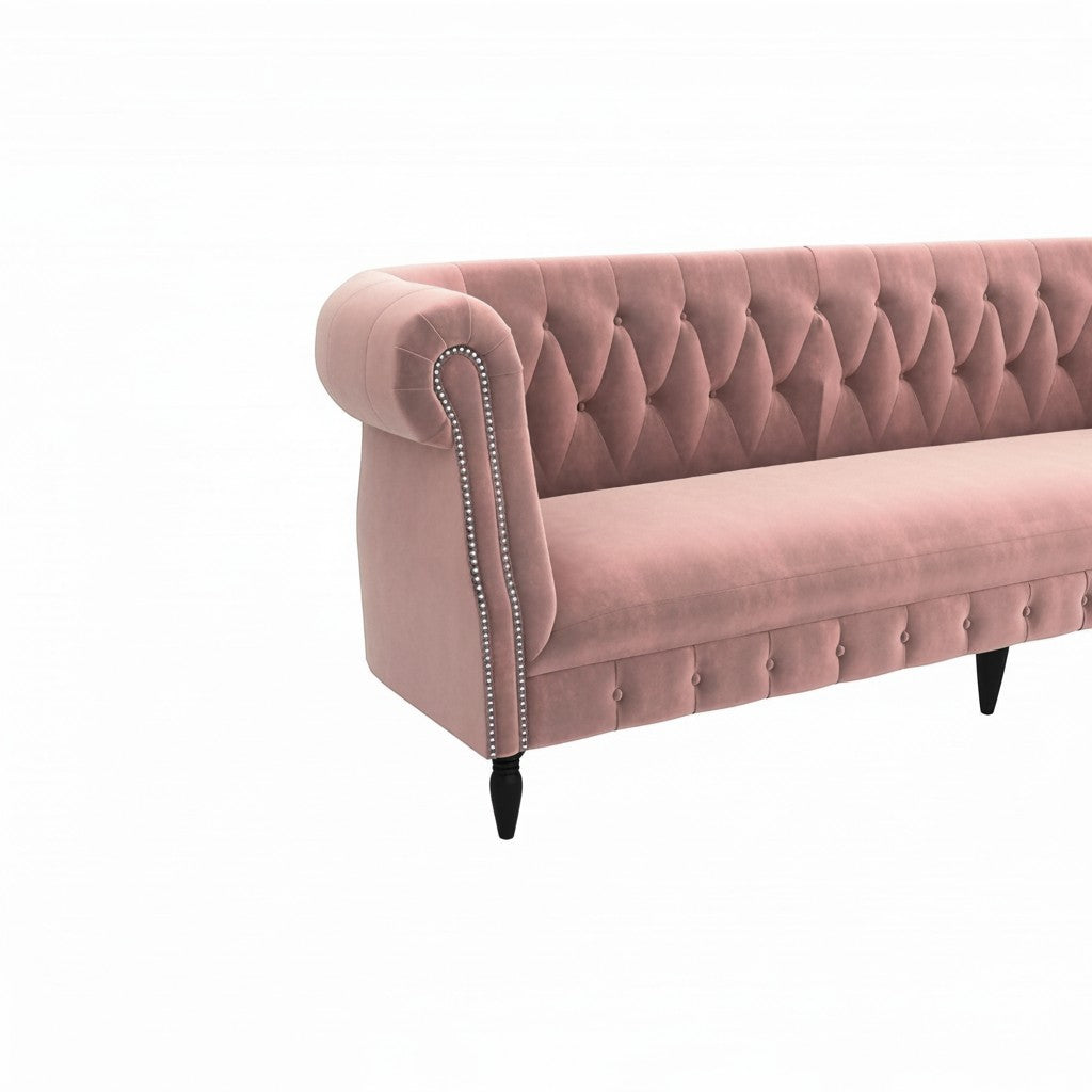 Homecrest Baslow Chesterfield sofa in rose dust velvet with button tufting, rolled arms, and silver nailhead trim.