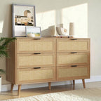Homecrest Bexley six-drawer chest in natural acacia wood with woven rattan cane drawer fronts and black metal handles.