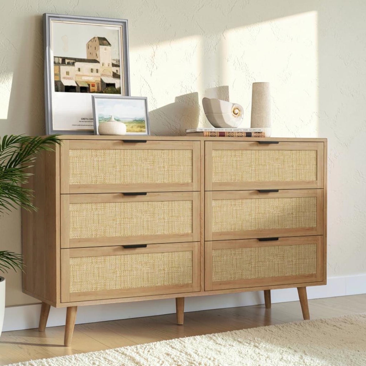 Homecrest Bexley six-drawer chest in natural acacia wood with woven rattan cane drawer fronts and black metal handles.