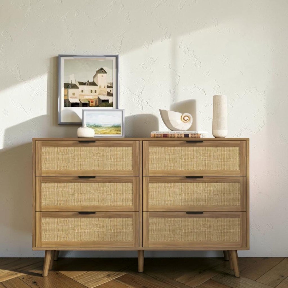 Homecrest Bexley six-drawer chest in natural acacia wood with woven rattan cane drawer fronts and black hardware.
