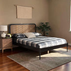 Homecrest classic bed frame in black acacia wood with natural rattan cane headboard in a cozy bedroom setting