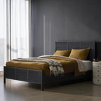 Homecrest black mango wood bed frame with a woven rattan headboard and footboard in a modern bedroom setting