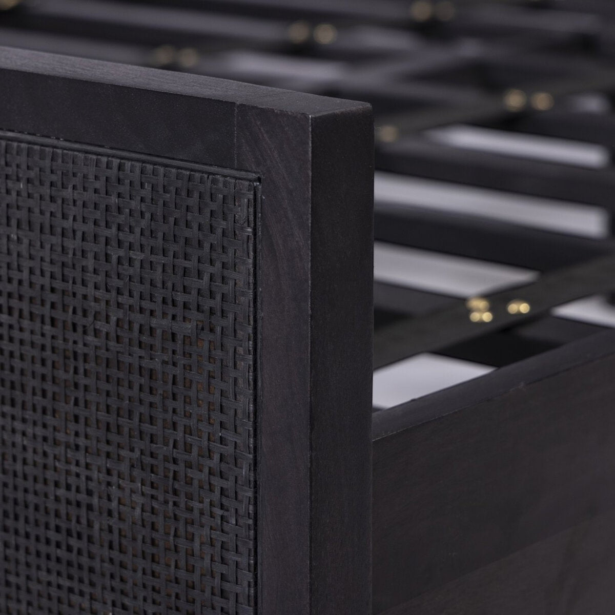 Homecrest black mango wood bed frame featuring a detailed close-up of the woven rattan headboard texture