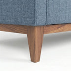 Homecrest 3-seater sofa featuring blue fabric upholstery and a natural solid wood base with tapered legs