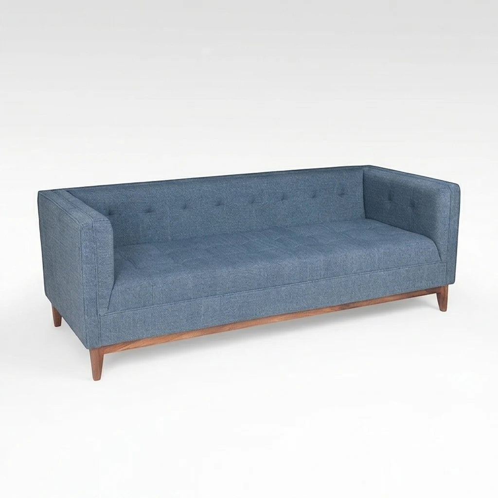Homecrest 3-seater sofa in blue fabric with a tufted back, box arms, and a natural solid wood base.