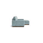 Homecrest Lomond sectional sofa in powder blue upholstery with solid wood base, shown from a side profile view.