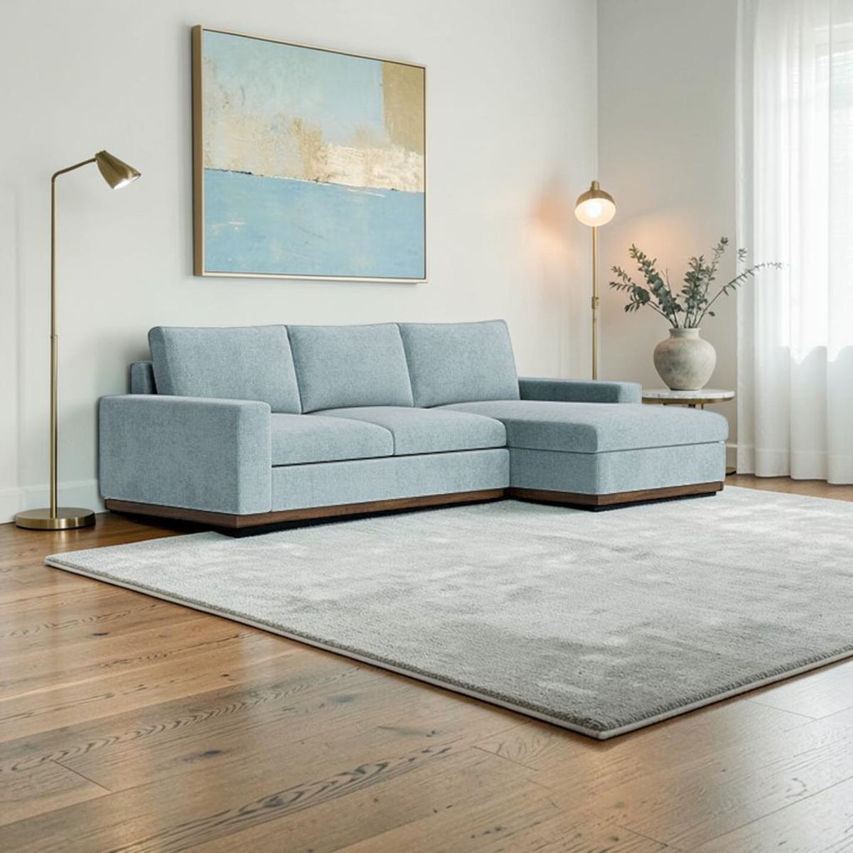 Homecrest Lomond sectional sofa in powder blue with solid wood base, wide armrests, and modular L-shaped design.