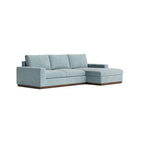 Homecrest Lomond powder blue modular L-shaped sectional sofa with wide armrests and solid wood base frame.