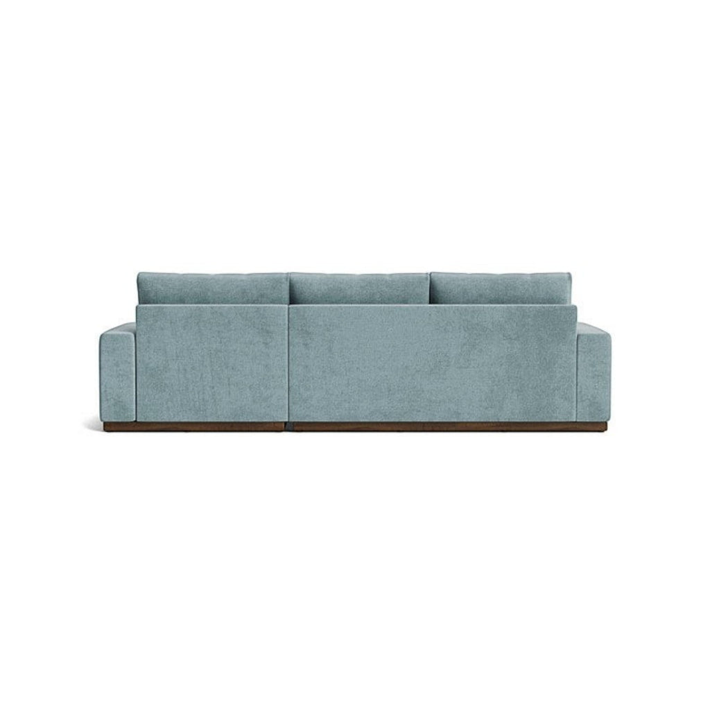 Homecrest Lomond sectional sofa in powder blue with solid wood base, viewed from the back.