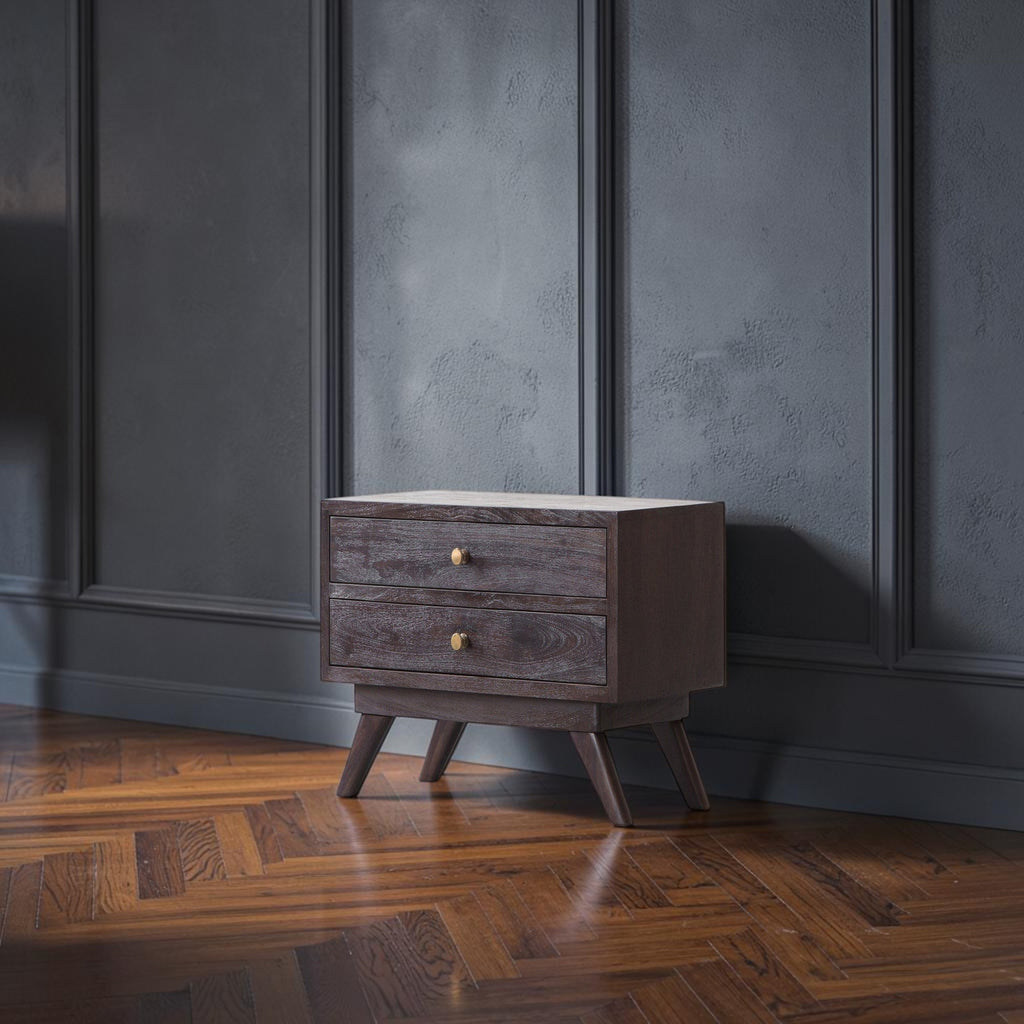 Homecrest Balcombe bedside table in solid dark hardwood with two drawers and brass knobs against a white brick wall