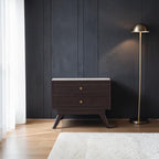 Homecrest Balcombe bedside table in dark solid hardwood with two drawers and brass knobs against a dark wall