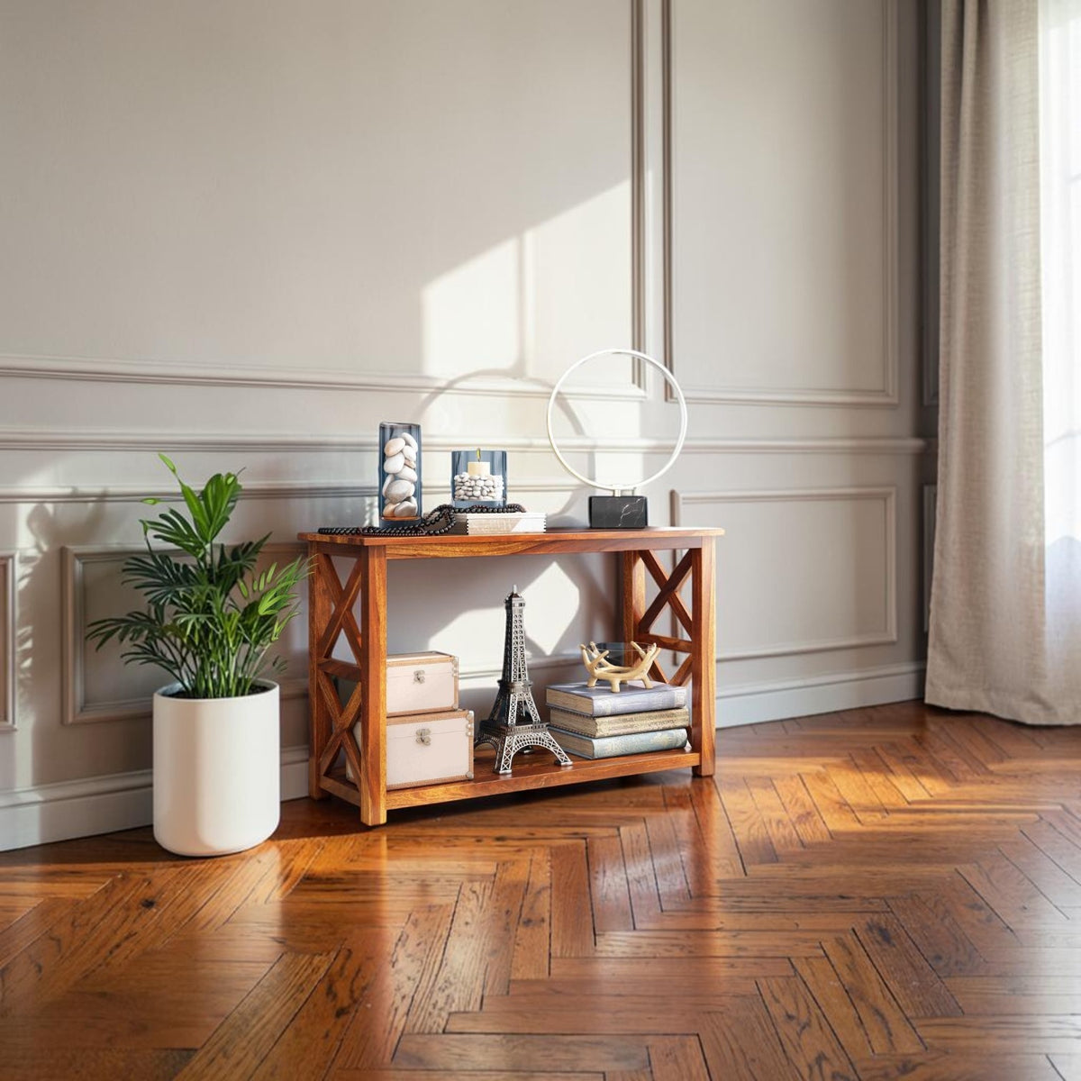 Homecrest Brae console table in solid sheesham wood with a contemporary cross-brace design in a living room setting