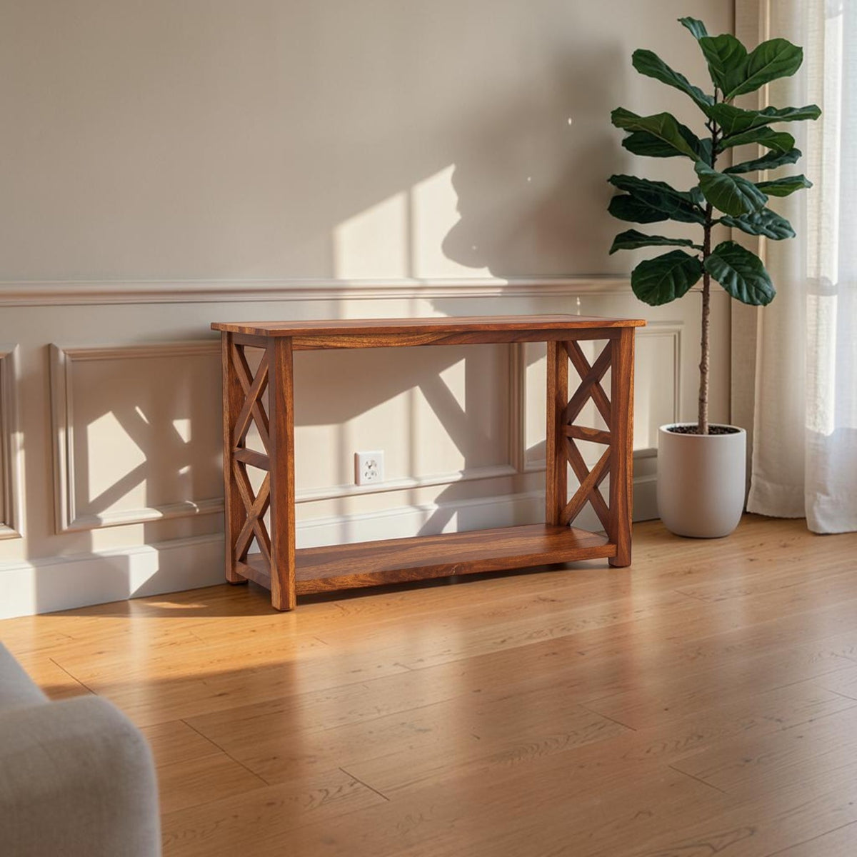 Homecrest Brae console table in solid sheesham wood with a contemporary X-frame side design in a living room setting.