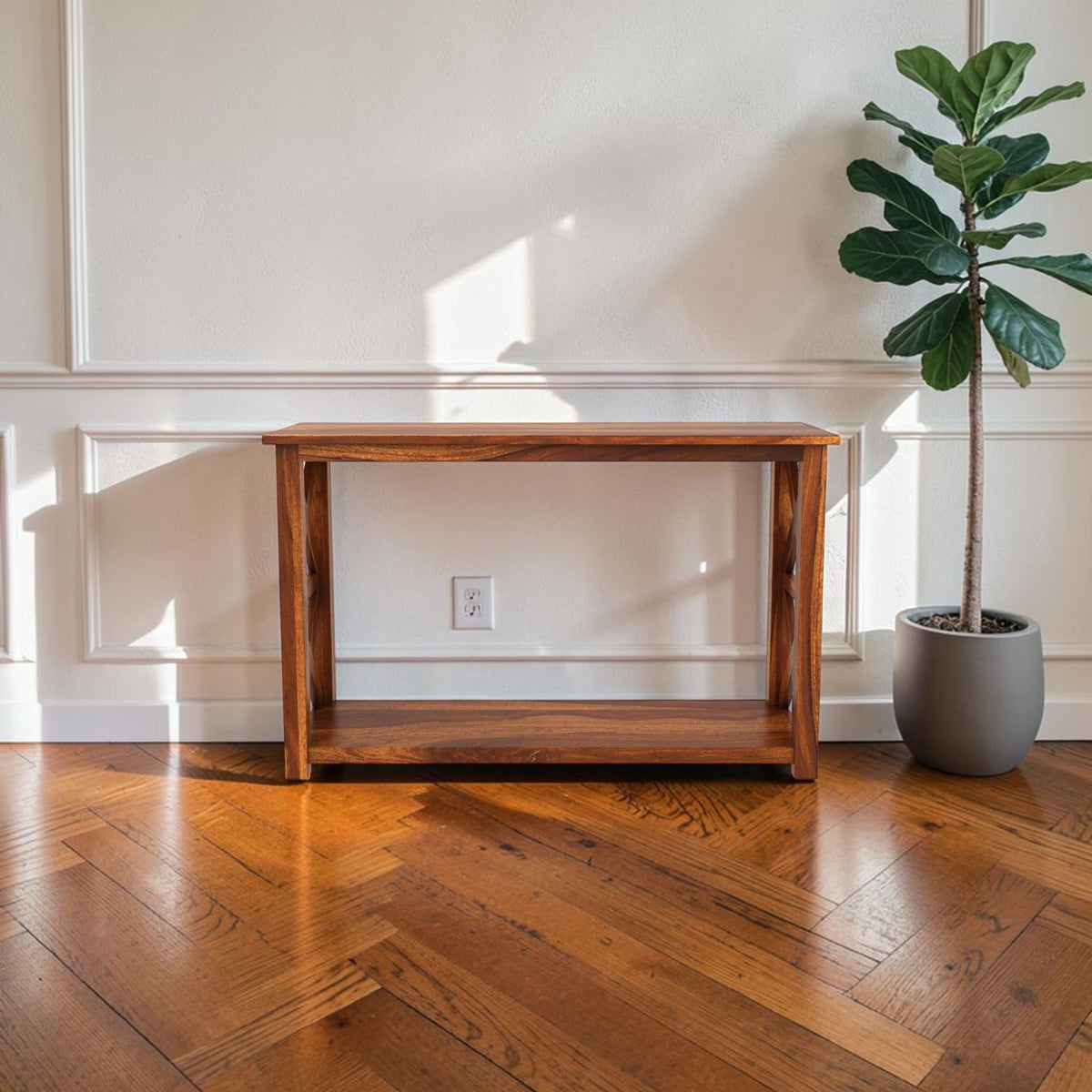 Homecrest Brae console table in solid sheesham wood with a contemporary design placed against a white wall