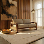 Homecrest Bramshaw 3 seater sofa in solid wood with beige fabric cushions and natural cane side panels in a living room