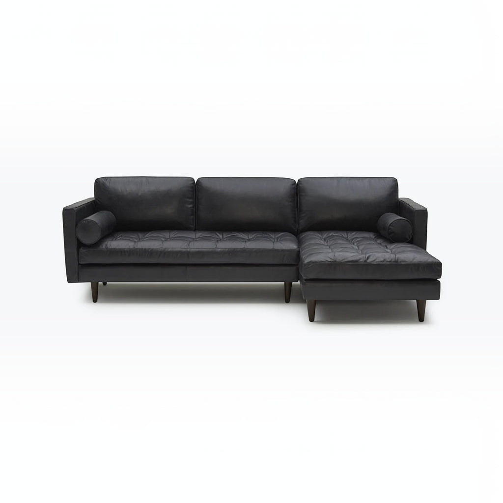 Homecrest Camber sectional sofa in black leather with button-tufted seating and a solid wood frame
